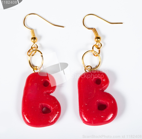 Image of Earrings in the form of a letter B on a white background