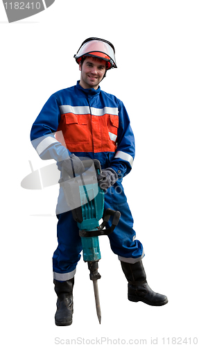 Image of Worker in overalls with an electric hammer