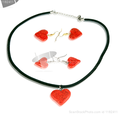 Image of Necklace and earrings in the form of the heart. Isolated on whit