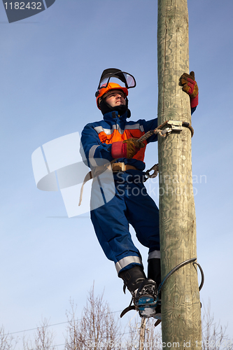 Image of Electrician on a pole