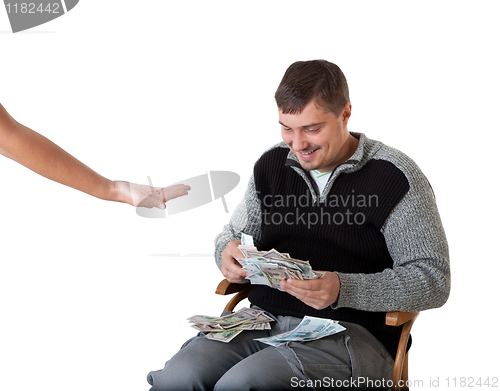 Image of Happy young man counts the money