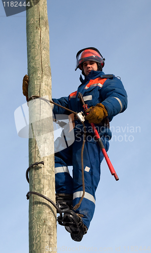 Image of Electrician on a pole