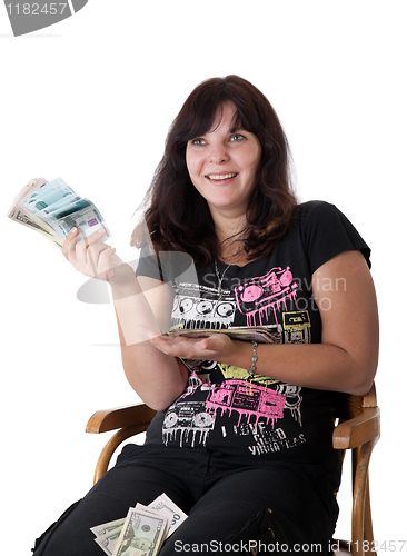 Image of Happy young girl holding a lot of money