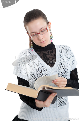 Image of Girl with glasses reading a book