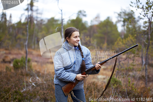 Image of Girl with shotgun