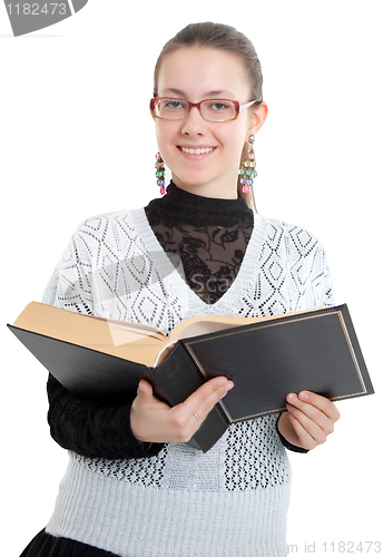 Image of Girl with glasses reading a thick book