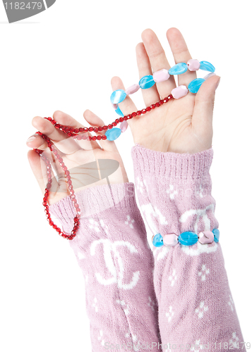 Image of The hands of girls showing glass ornaments