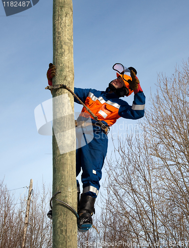 Image of Electrician on a pole