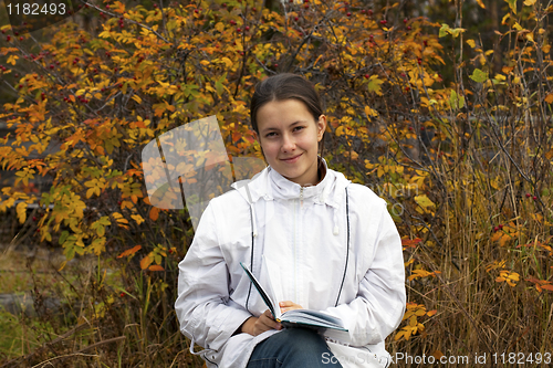 Image of Young girl with a book