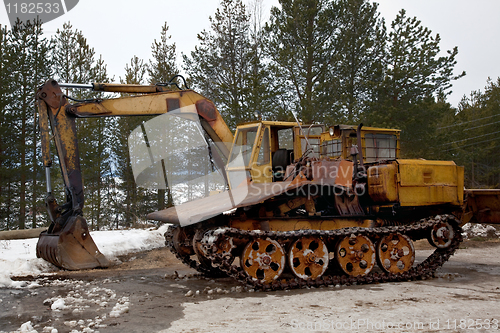 Image of Tracked vehicles. Excavator and trelevochnik