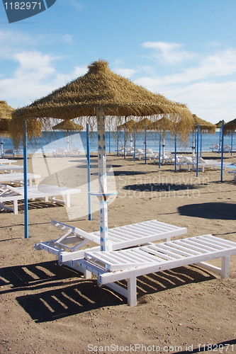 Image of sunbeds and parasols