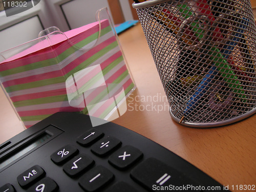 Image of notepaper calculator and pen bin
