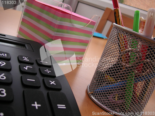 Image of students calculator and pens with note paper