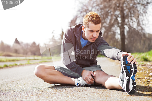 Image of Mixed race man stretching