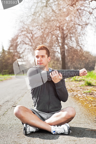 Image of Mixed race man stretching