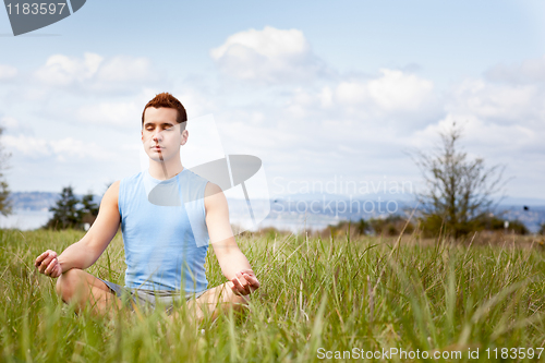 Image of Mixed race man practicing yoga