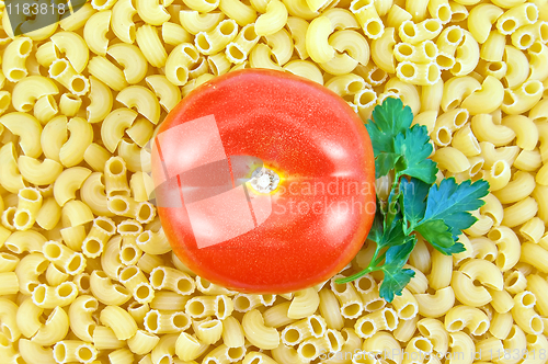 Image of Pasta with whole tomato and parsley