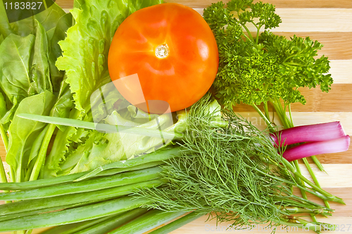 Image of Tomatoes with herbs on the board