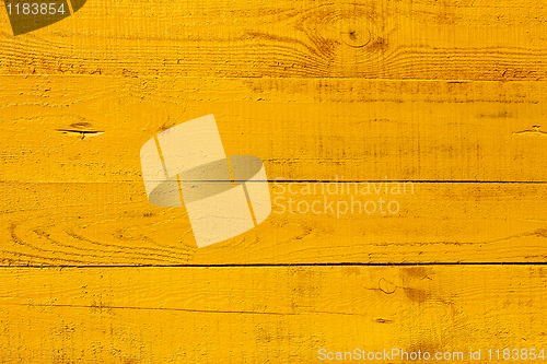 Image of Detail of yellow wooden fence