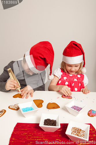 Image of Girls decorating gingerbread cookies