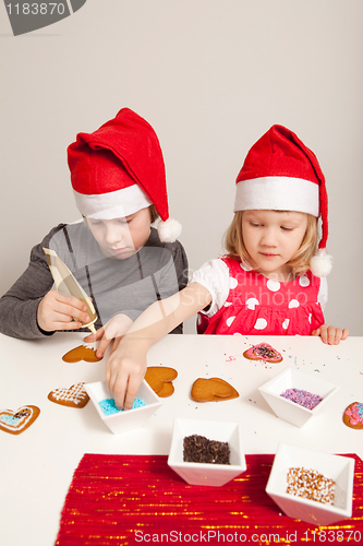 Image of Girls decorating gingerbread cookies