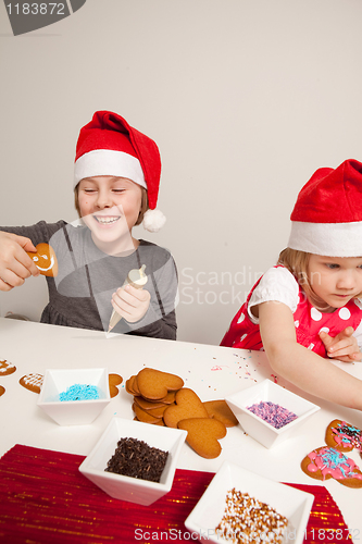 Image of Girls decorating gingerbread cookies