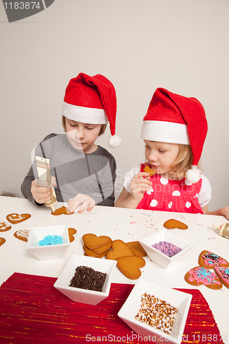 Image of Girls decorating gingerbread cookies