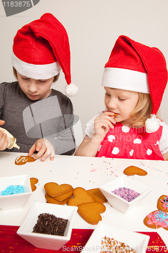 Image of Girls decorating gingerbread cookies