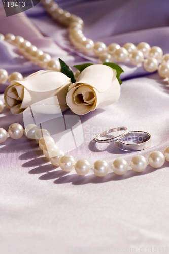 Image of wedding rings and roses