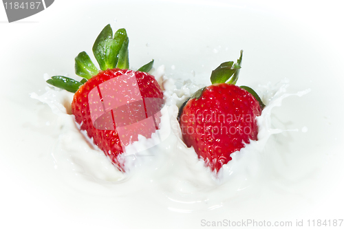 Image of strawberry splashing into milk