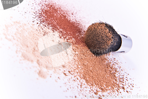 Image of makeup brush and powder