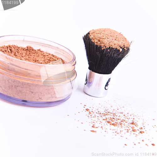 Image of makeup brush and powder