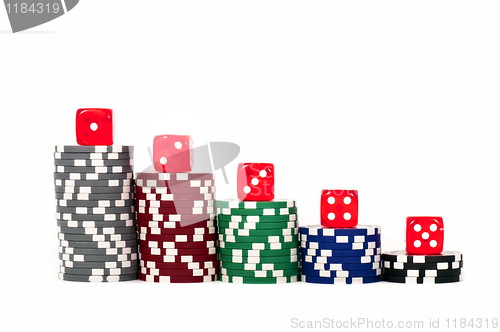 Image of Piled poker chips with dice