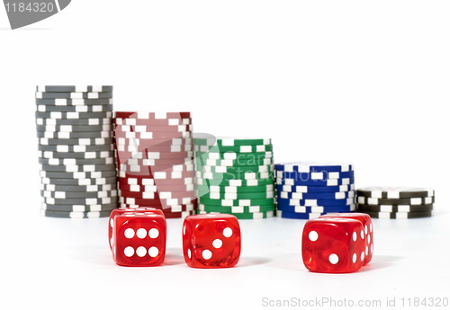 Image of Piled poker chips with dice