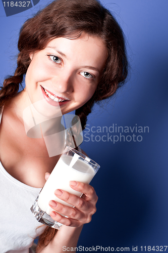 Image of woman enjoying a glass milk