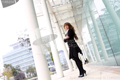 Image of pretty asian business woman at office building 