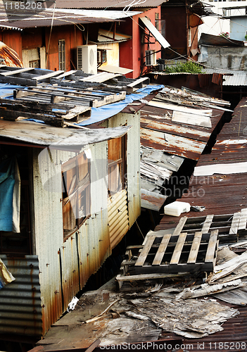 Image of old rusty metal housing at day 