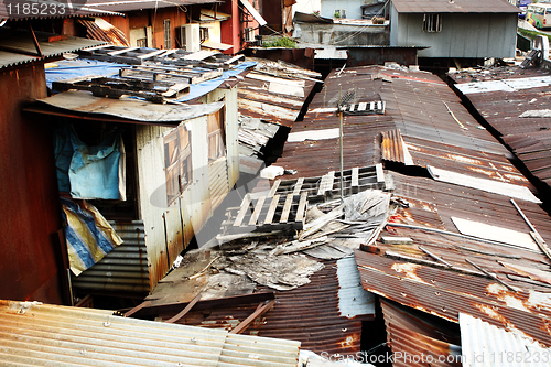 Image of old rusty metal housing at day 