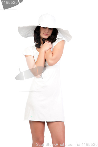 Image of young woman in white dress and hat