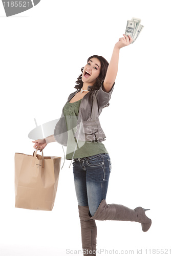 Image of young woman with shopping and cash