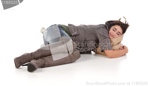 Image of young woman with shopping and cash