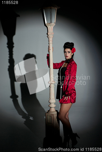 Image of young woman and lightpole