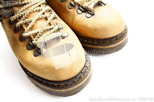 Image of closeup of old yellow boots