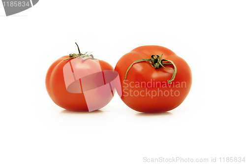 Image of two red tomatoes on white background