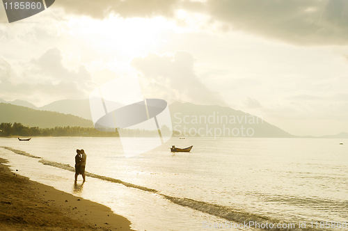Image of Falling in love couple on the beach