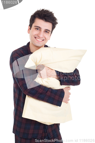 Image of Man in pajamas holding pillow