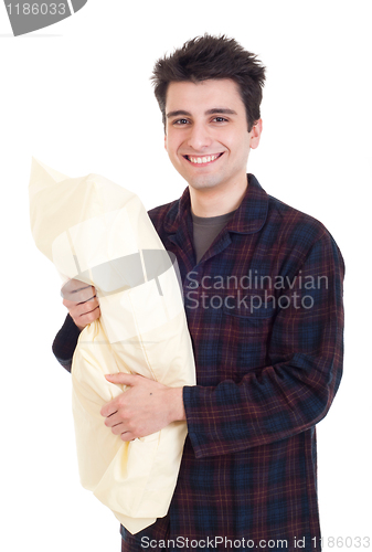 Image of Man in pajamas holding pillow