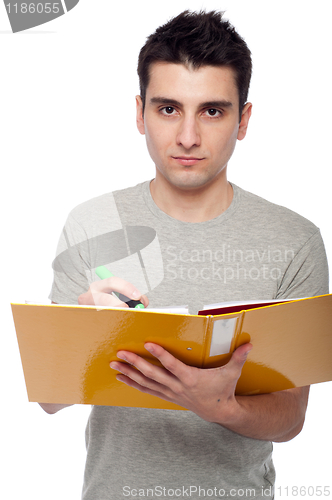 Image of Man studying with dossier