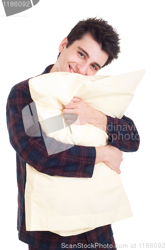 Image of Man in pajamas holding pillow