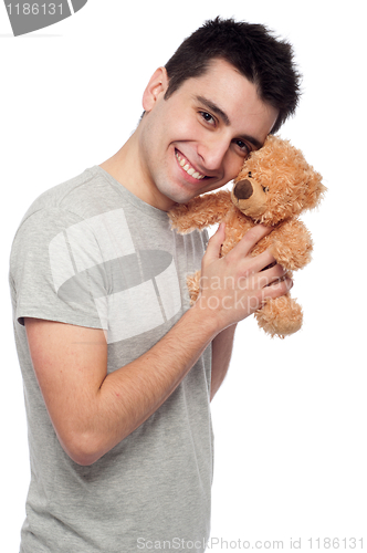 Image of Man cludding teddy bear